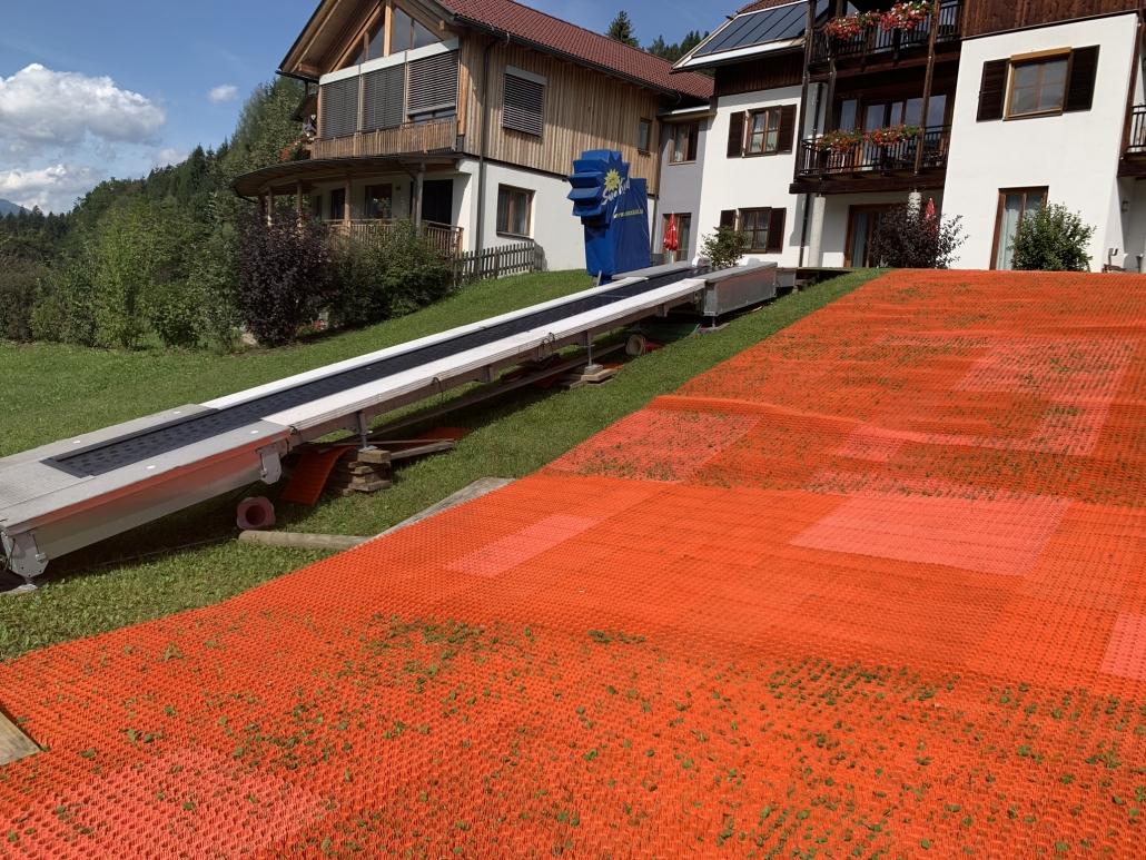 Kinderhotel Ramsi - summer ski school - magic carpet for skiing in the green